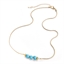 Collier doré 3 pierres turquoise